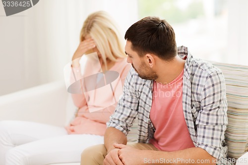 Image of unhappy couple having argument at home