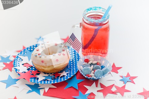 Image of donut with juice and candies on independence day