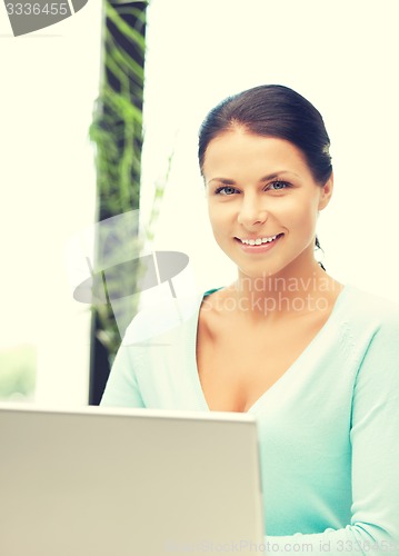 Image of happy woman with laptop computer