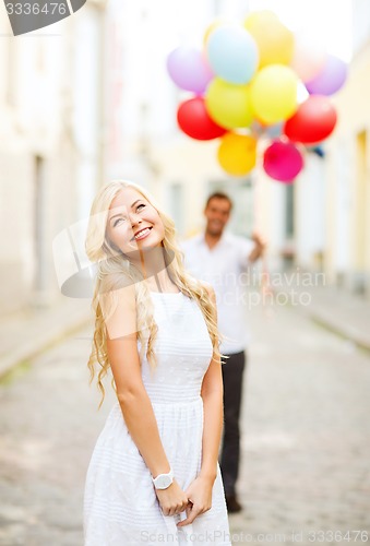 Image of couple with colorful balloons