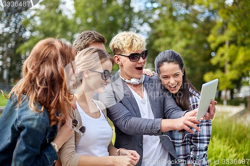 Image of students or teenagers with tablet pc taking selfie