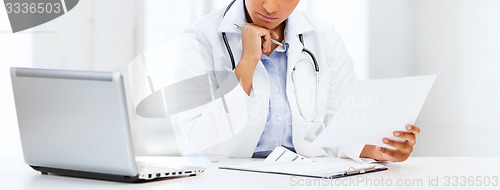 Image of female doctor with laptop pc