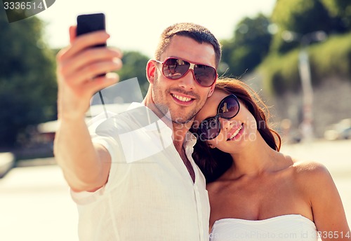 Image of smiling couple in city
