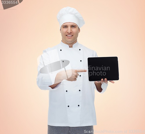 Image of happy male chef cook showing with tablet pc