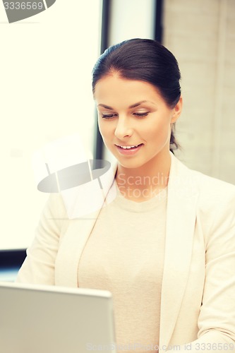 Image of happy woman with laptop computer