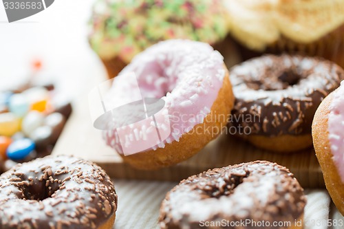 Image of close up of glazed donuts pile on table