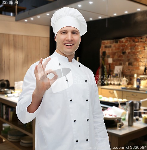 Image of happy male chef cook showing ok sign