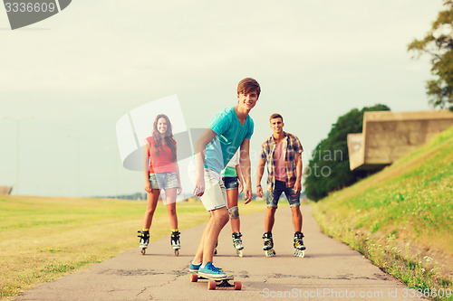 Image of group of smiling teenagers with roller-skates