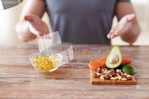 Image of close up of male hands with food rich in protein