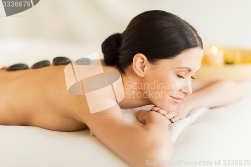 Image of woman in spa with hot stones