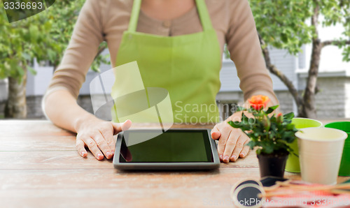 Image of close up of woman or gardener with tablet pc