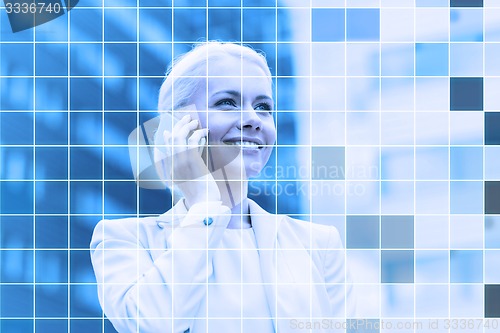 Image of smiling businesswoman with smartphone outdoors