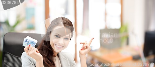 Image of happy business woman with euro cash money