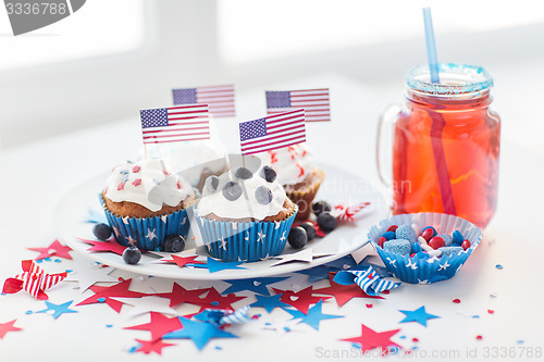 Image of cupcakes with american flags on independence day