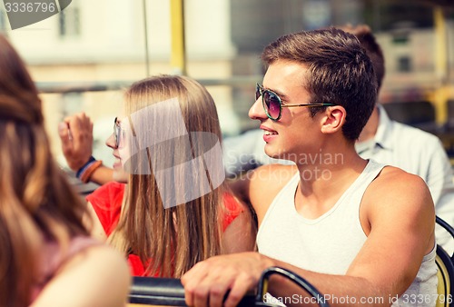 Image of smiling couple traveling by tour bus