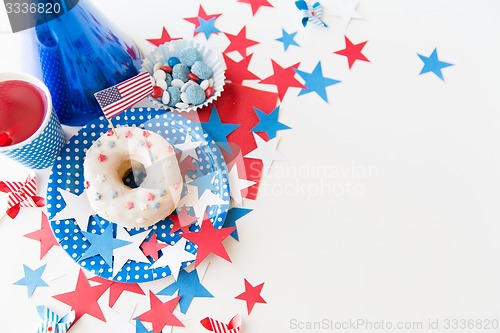 Image of donut with juice and candies on independence day