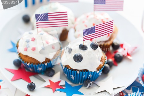 Image of cupcakes with american flags on independence day