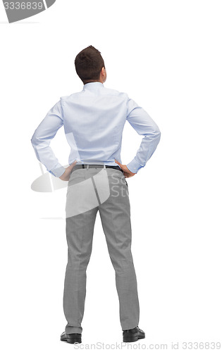 Image of businessman looking up from back