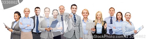 Image of group of happy business people pointing at you