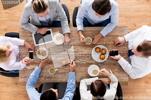 Image of close up of business team drinking coffee on lunch