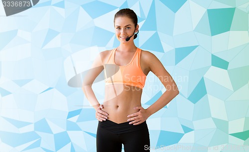 Image of female sports trainer with microphone woman