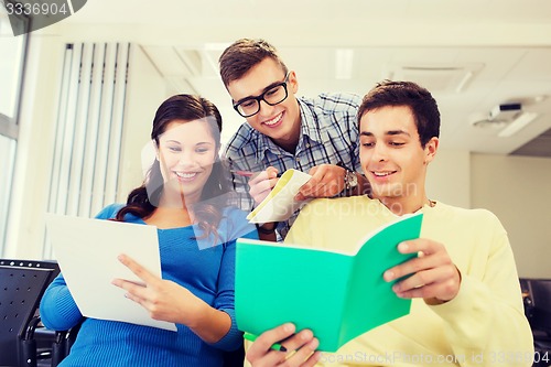 Image of group of smiling students in lecture hall