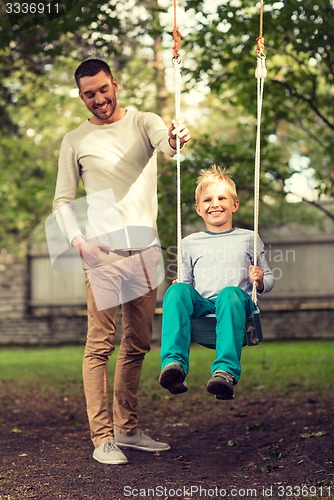 Image of happy family in front of house outdoors