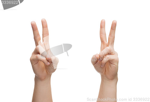 Image of man hands showing v-sign