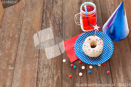 Image of donut with juice and candies on independence day