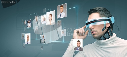 Image of man with futuristic 3d glasses and sensors