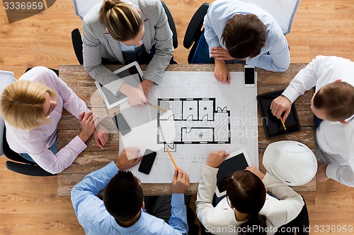 Image of close up of business team sitting at table
