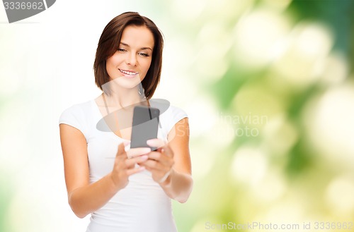 Image of woman taking selfie with smartphone