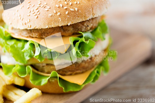 Image of close up of hamburger or cheeseburger on table