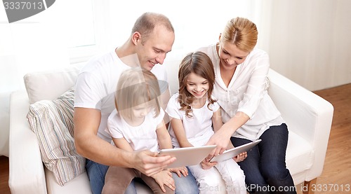 Image of happy family with tablet pc computers at home