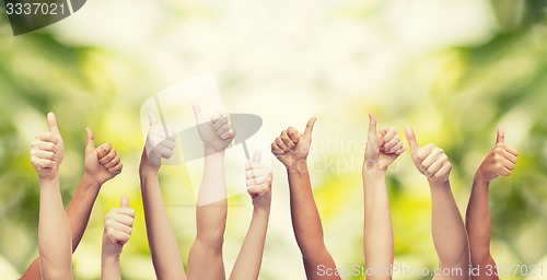 Image of human hands showing thumbs up