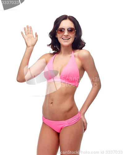 Image of happy woman in sunglasses and bikini swimsuit