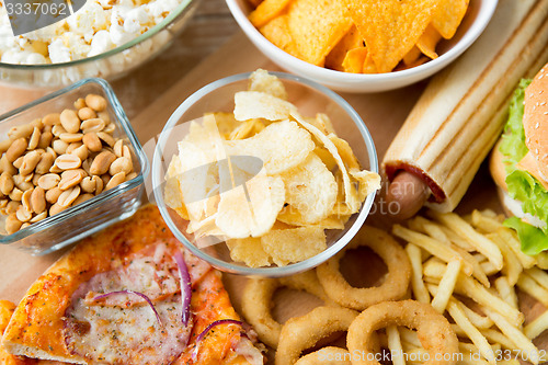 Image of close up of fast food snacks and drink on table