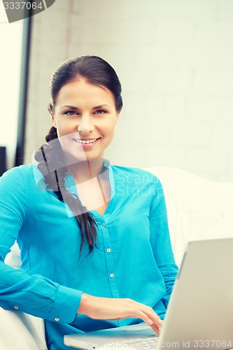 Image of happy woman with laptop computer