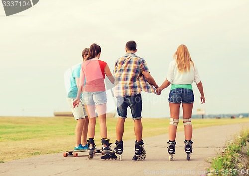 Image of group of teenagers with roller-skates