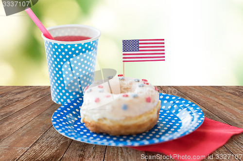 Image of donut with juice and american flag decoration