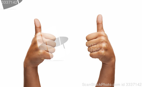 Image of woman hands showing thumbs up