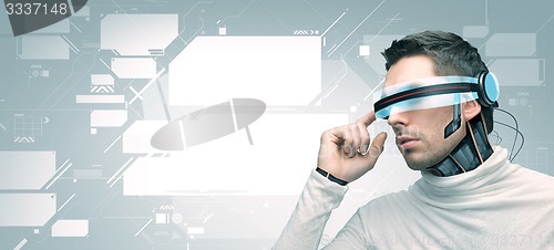 Image of man with futuristic 3d glasses and sensors