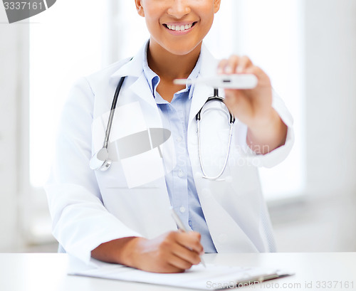 Image of doctor with thermometer and stethoscope