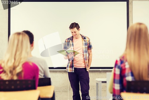 Image of group of smiling students in classroom