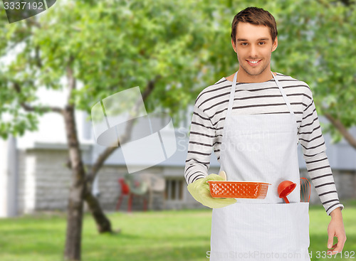 Image of happy man or cook with baking and kitchenware