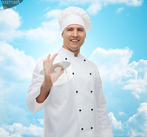 Image of happy male chef cook showing ok sign