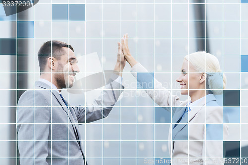 Image of smiling businessmen outdoors