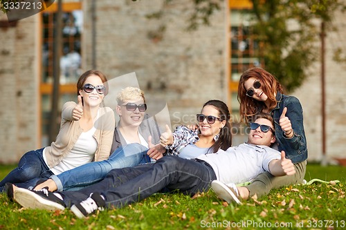 Image of group of students or teenagers showing thumbs up