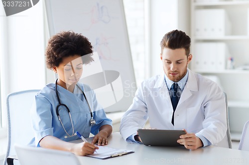 Image of two doctors meeting at hospital office