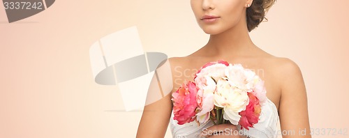 Image of bride or woman with bouquet of flowers